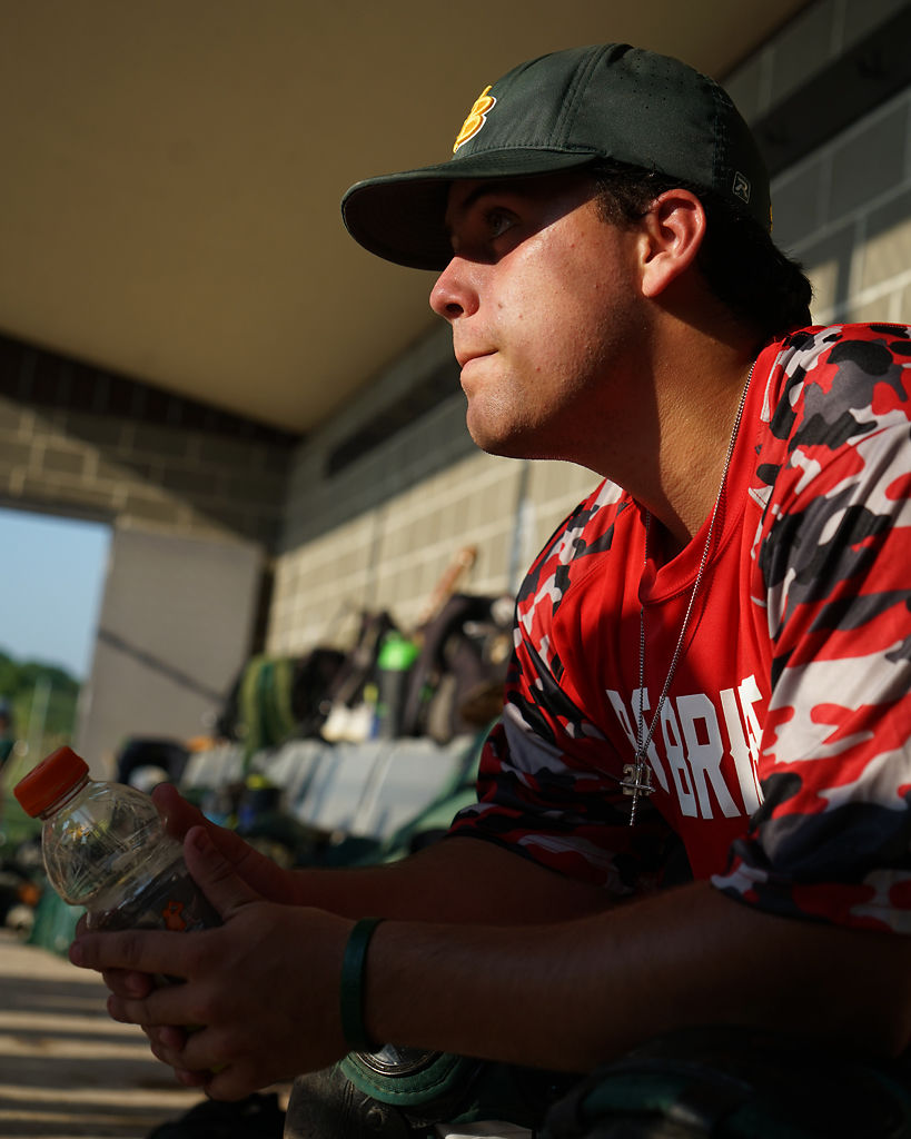 Rock Bridge catcher Landen Owen sits in the dugout
